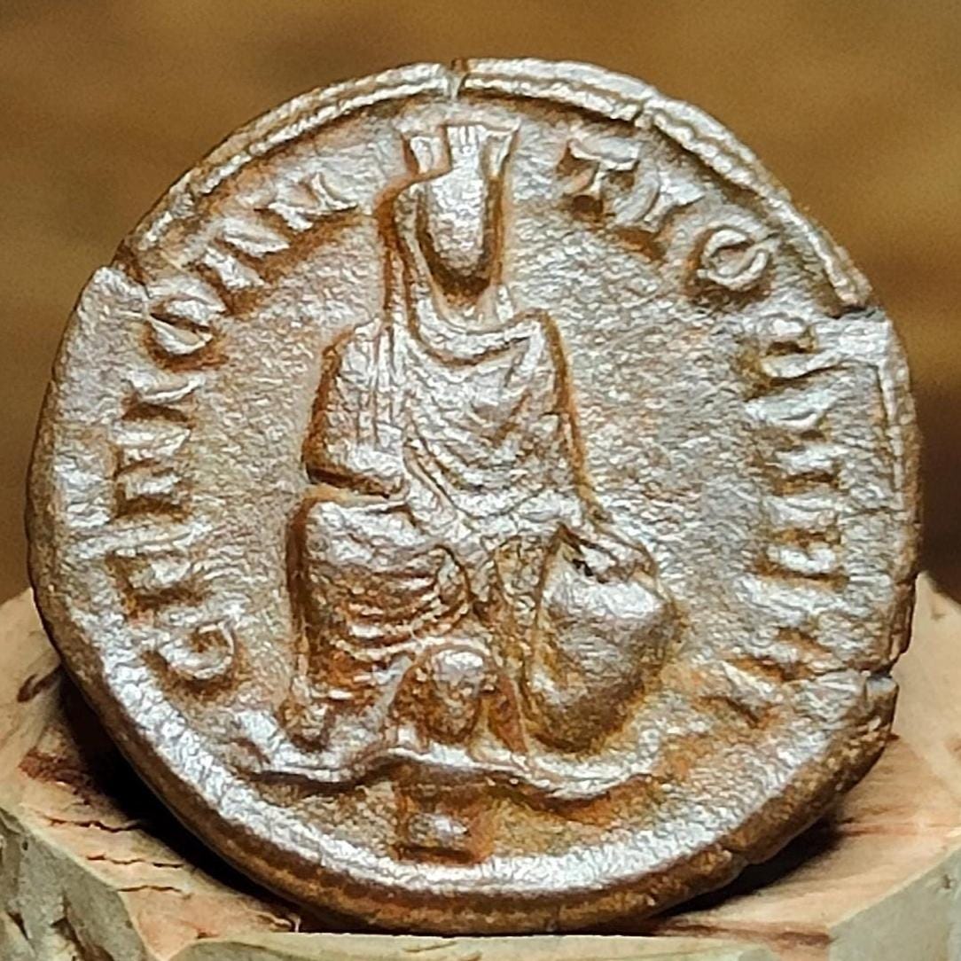 Christian persecution issue roman coin featuring Apollo and Genius
