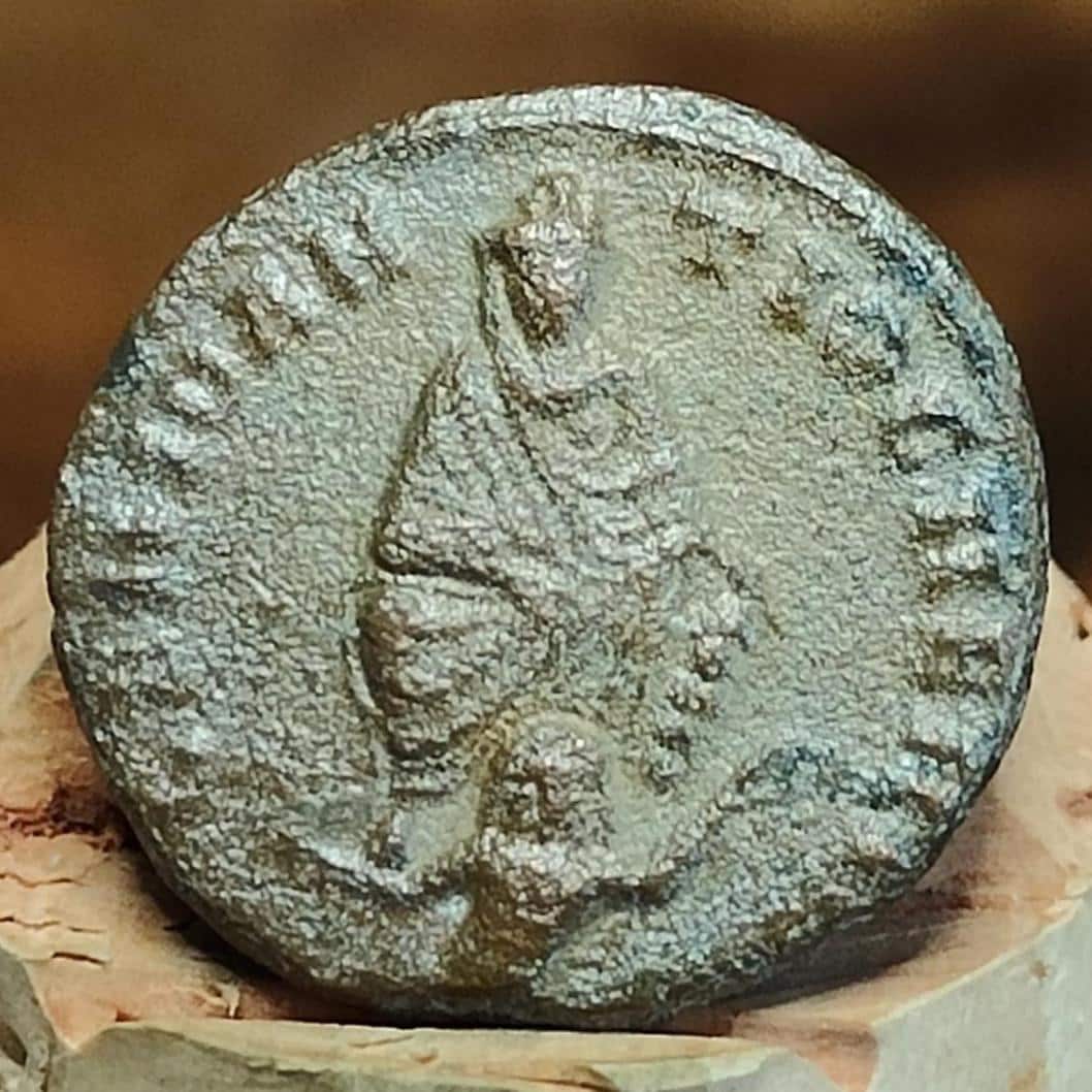Christian persecution issue roman coin featuring Apollo and Genius