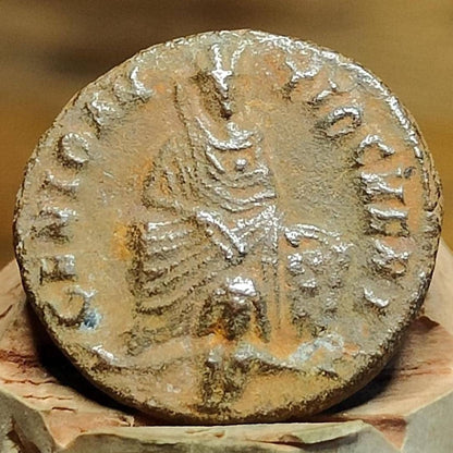Christian persecution issue roman coin featuring Apollo and Genius, 310-313AD