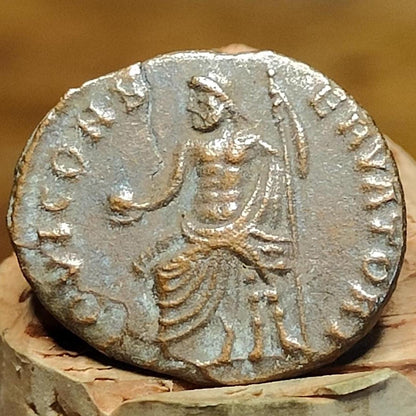 Christian persecution issue roman coin featuring Apollo and Genius, 310-313AD