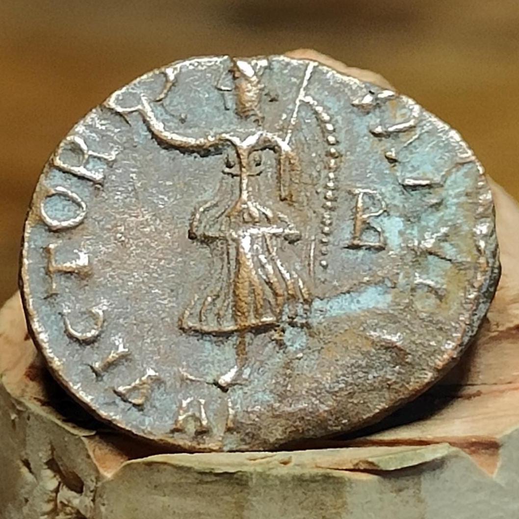 Christian persecution issue roman coin featuring Apollo and Genius, 310-313AD