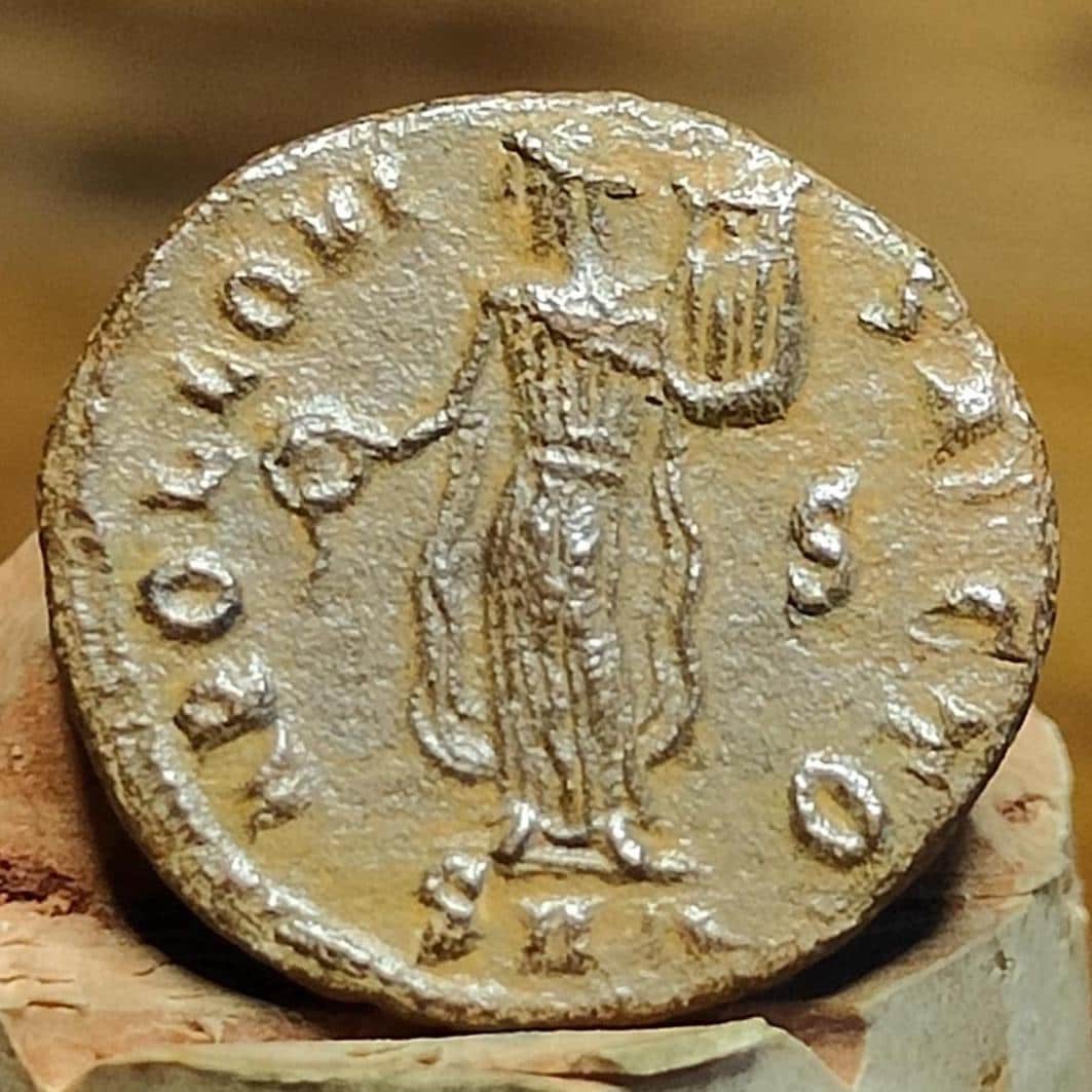 Christian persecution issue roman coin featuring Apollo and Genius, 310-313AD